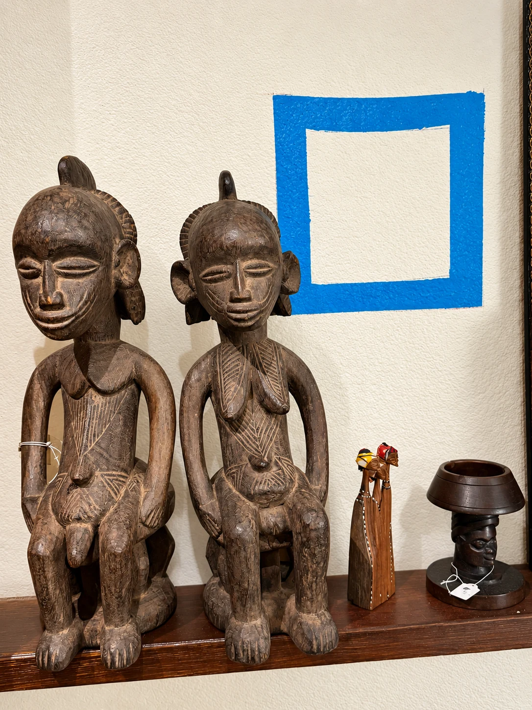 Carved heritage figures on display from Thandi and Sapio